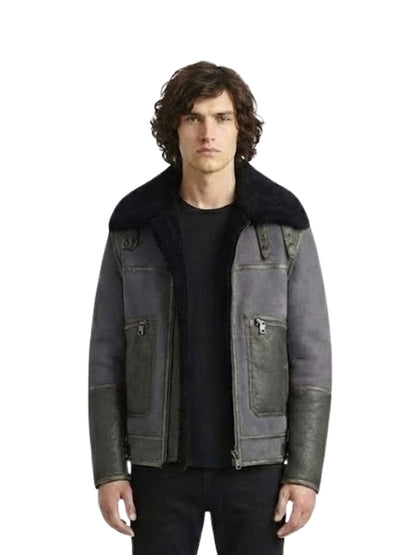 Man wearing a dark gray jacket with black fur collar on a white background