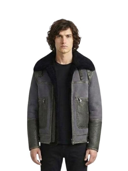 Man wearing a dark gray jacket with black fur collar on a white background