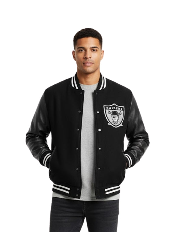 Man wearing a black varsity jacket with a logo on a white background
