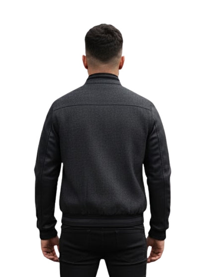 Man wearing a dark gray jacket on a white background