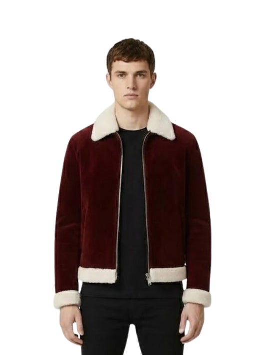 Man wearing a burgundy jacket with white trim on a white background