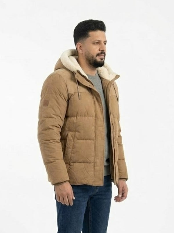 Man wearing a brown puffer jacket with a white background