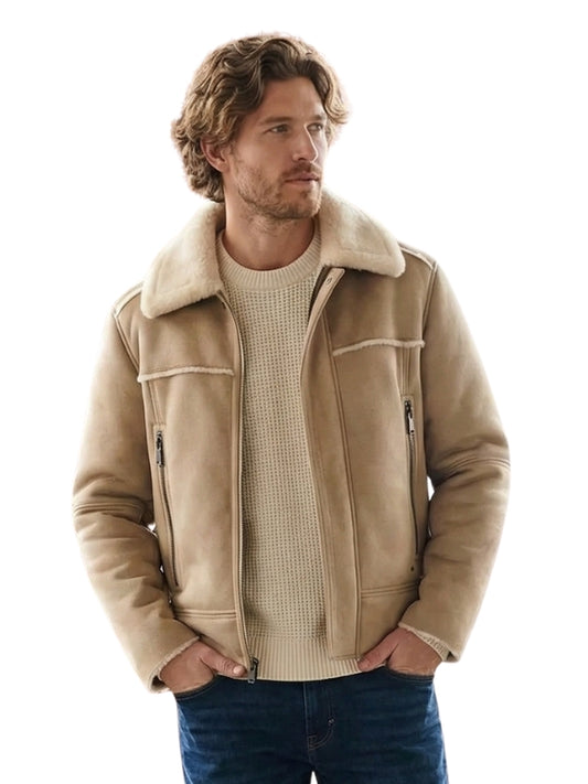 Man wearing a beige shearling jacket on a white background