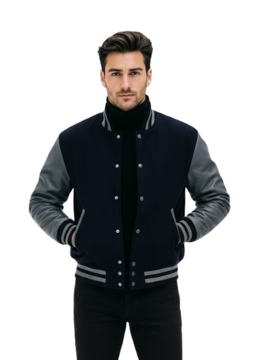 Man wearing a black and gray varsity jacket on a white background