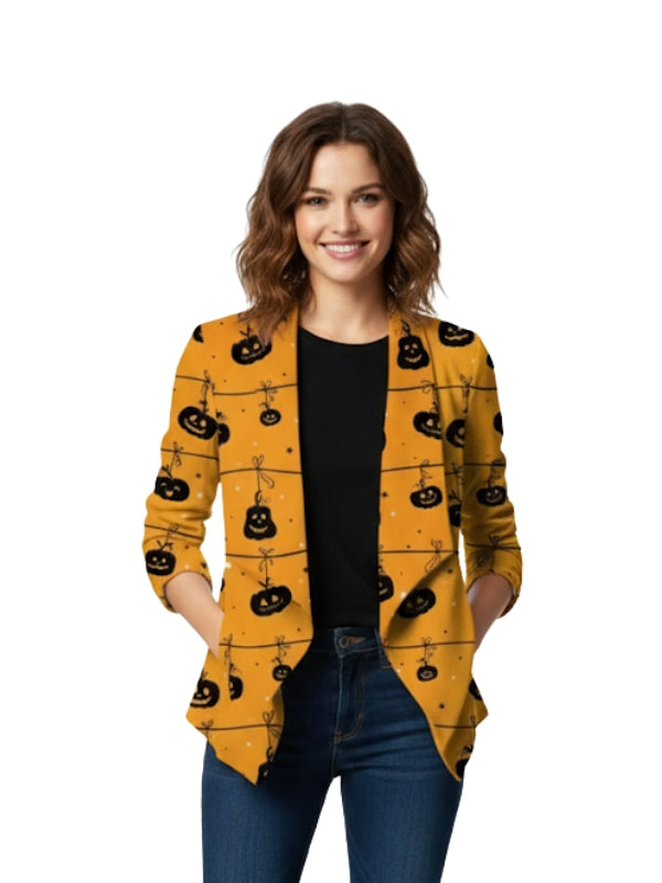 Woman wearing a yellow cardigan with black pumpkin patterns on a white background