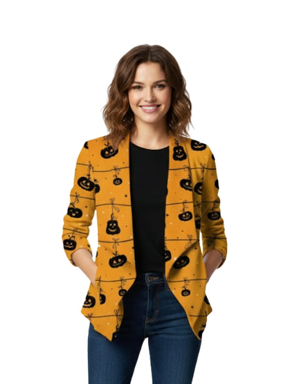 Woman wearing a yellow cardigan with black pumpkin patterns on a white background