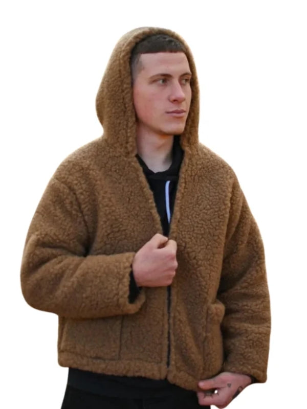 Man wearing a brown hooded jacket on a white background