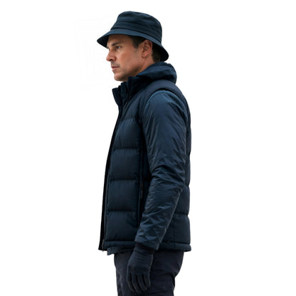 Man wearing a dark blue puffer jacket and hat on a white background