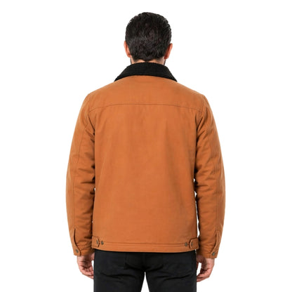 Person wearing a brown jacket and standing in front of a white background