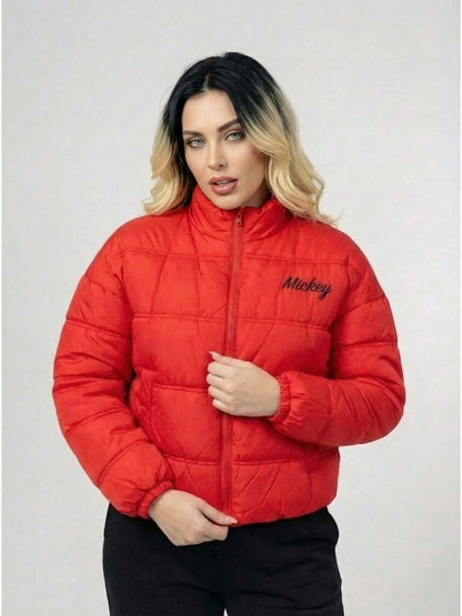 Person wearing a red puffer jacket with 'Mickey' branding on a light gray background