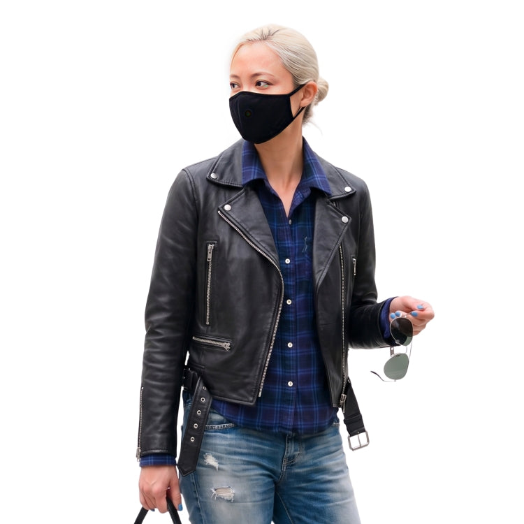 Person wearing a black leather jacket, plaid shirt, and jeans on a white background