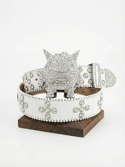Silver belt buckle with crystals on a white belt, displayed on a wooden stand against a white background.