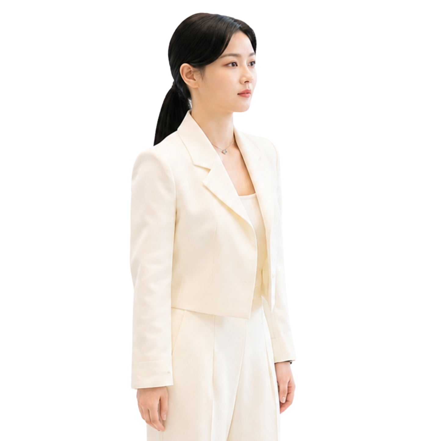 Woman wearing a light-colored suit on a white background