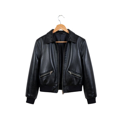Black leather jacket on a wooden hanger against a white background