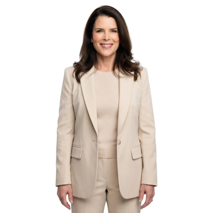 Woman wearing a beige suit on a white background