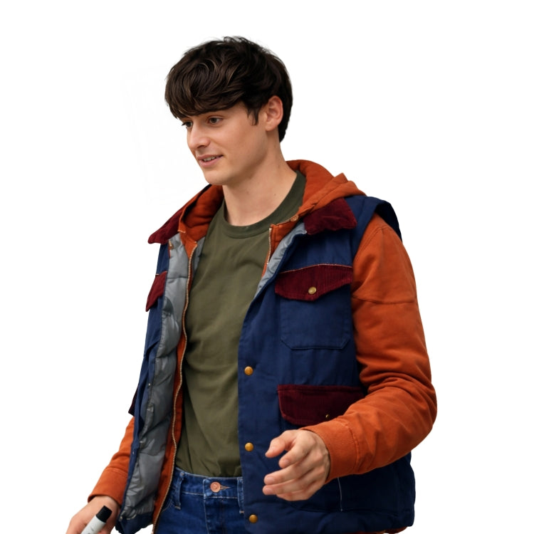 Person wearing a colorful jacket with orange and blue accents on a white background