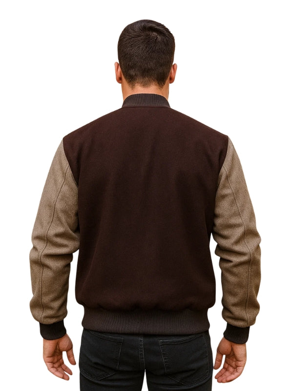 Man wearing a two-tone jacket with brown and beige sleeves on a white background