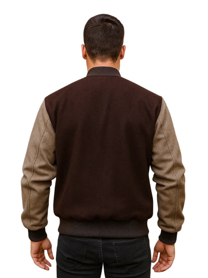 Man wearing a two-tone jacket with brown and beige sleeves on a white background