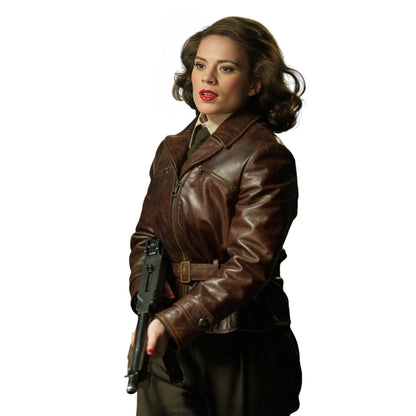 Woman wearing a brown leather jacket holding a gun on a white background