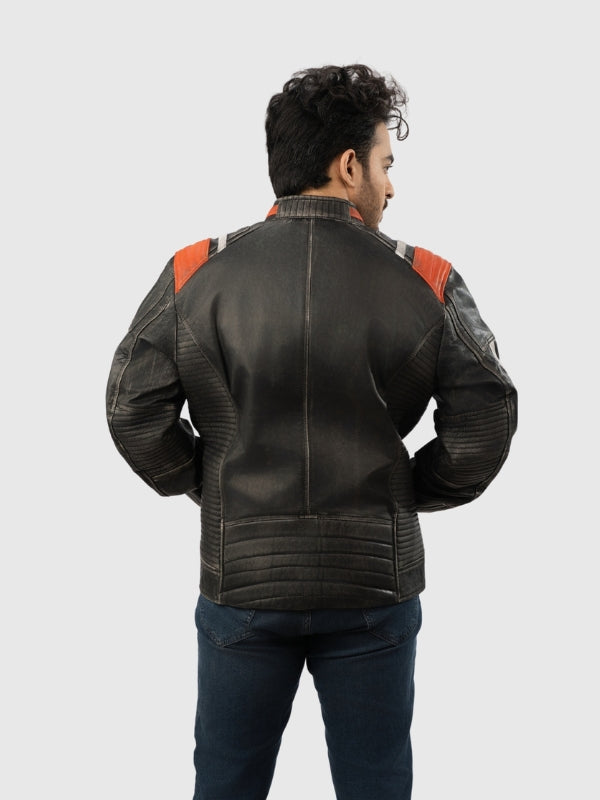 Man wearing a black leather jacket with red accents on a white background