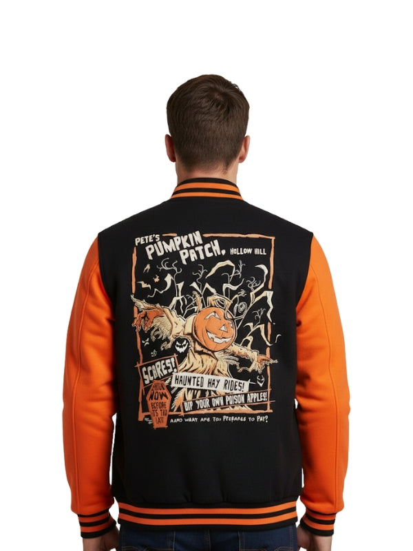 Person wearing a Halloween-themed black and orange jacket with graphics on the back.