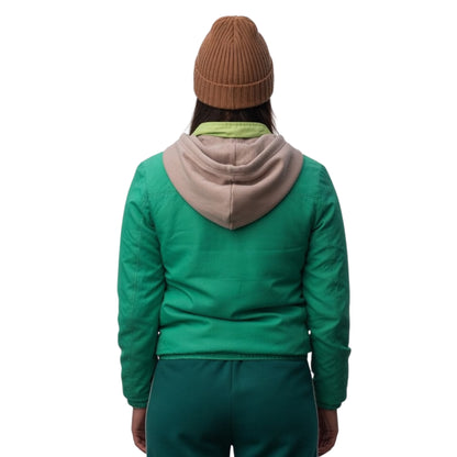 Person wearing a green jacket with a beige hood on a white background