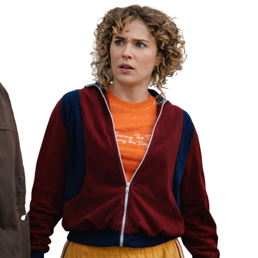 Person wearing a red and blue jacket over an orange shirt with text, on a white background