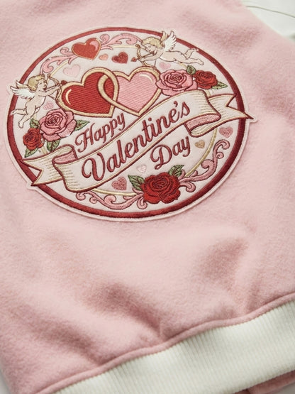 Pink sweatshirt with a 'Happy Valentine's Day' embroidered design featuring hearts and roses.
