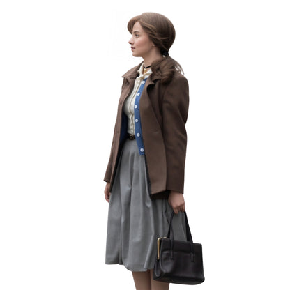 Woman in a brown coat with a gray skirt and black handbag on a white background