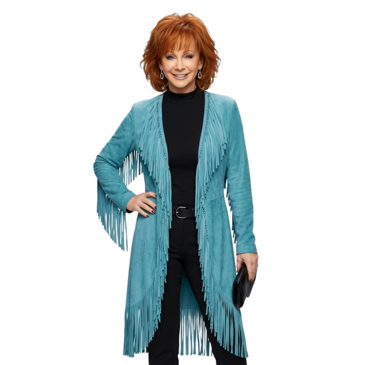 Woman wearing a turquoise fringed jacket on a white background
