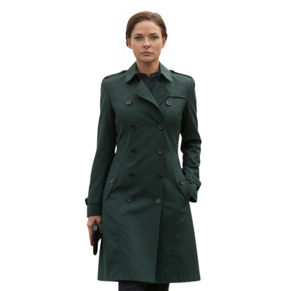 Woman wearing a green trench coat on a white background