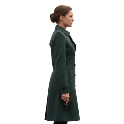Woman wearing a green coat on a white background