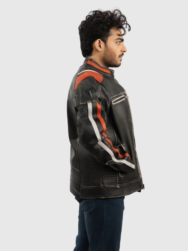 Man wearing a black leather jacket with orange and white accents on a light gray background