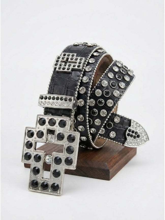 Black belt with silver studs on a wooden stand against a white background