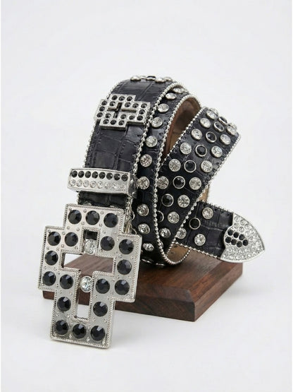 Black belt with silver studs on a wooden stand against a white background