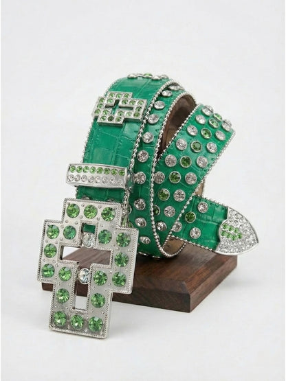 Green high-heeled shoes with rhinestone embellishments on a white background