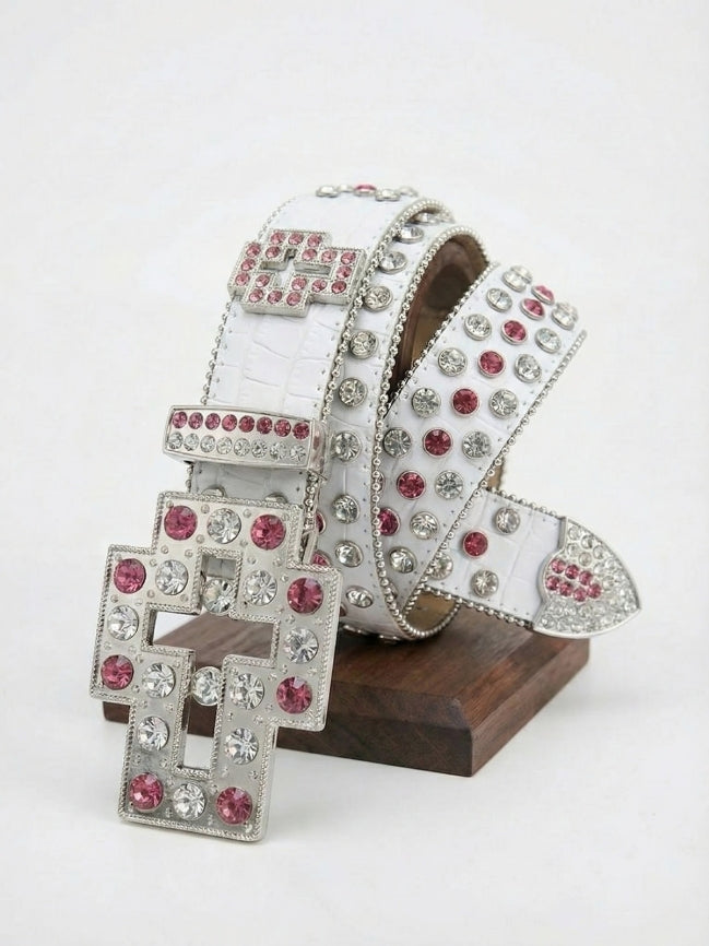 White belt with silver and pink gemstones on a wooden stand against a white background
