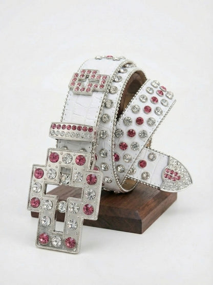 White belt with silver and pink gemstones on a wooden stand against a white background