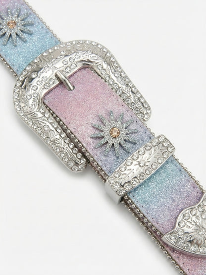 Decorative belt with pastel colors and sparkling embellishments on a white background