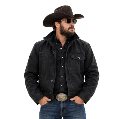Man wearing a black jacket, jeans, and a cowboy hat on a white background