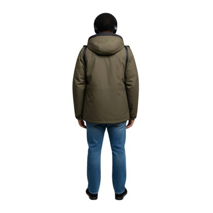 Person wearing a green jacket and blue jeans on a white background