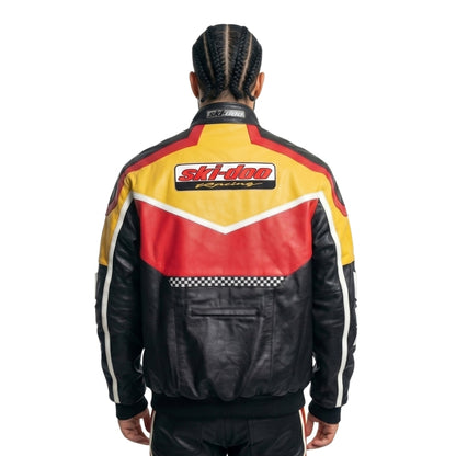 Person wearing a colorful racing jacket with 'Ski-Doo Racing' logo on a white background