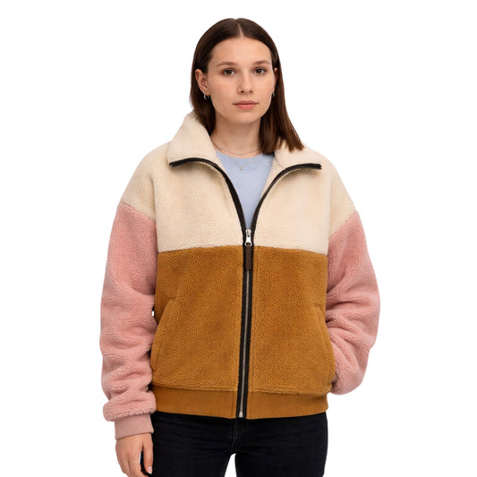 Woman wearing a multicolored fleece jacket on a white background