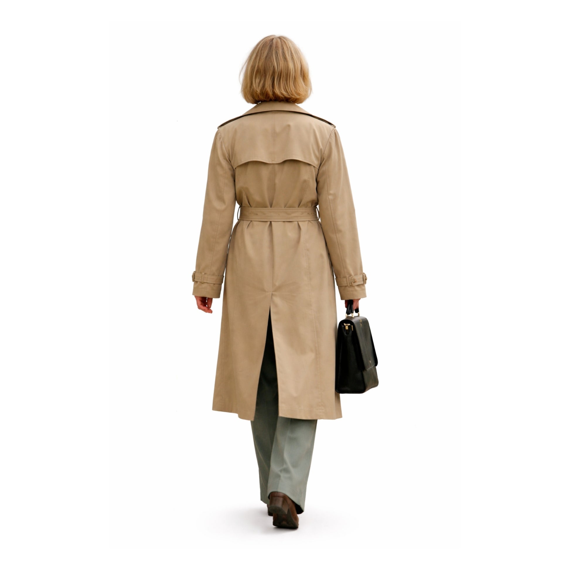 Person wearing a beige trench coat on a white background