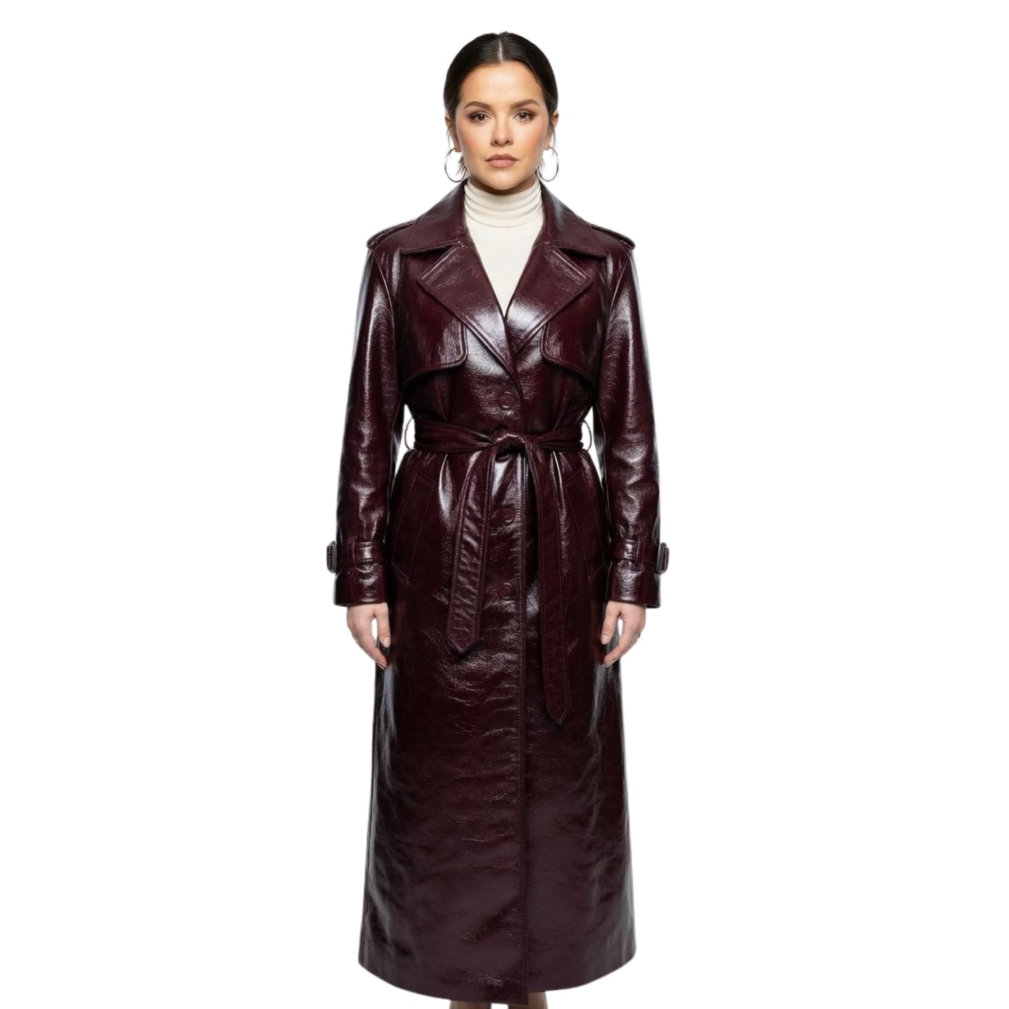 Woman wearing a long brown leather coat on a white background
