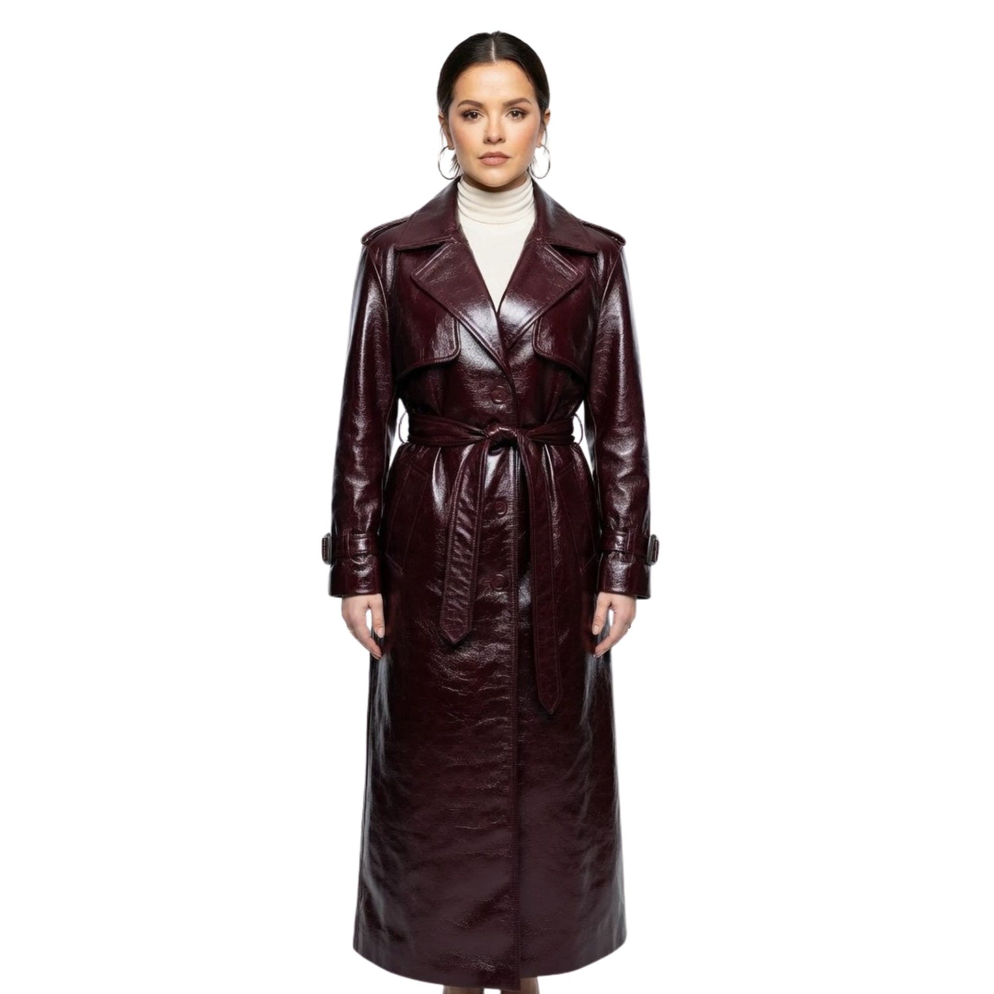 Woman wearing a long brown leather coat on a white background