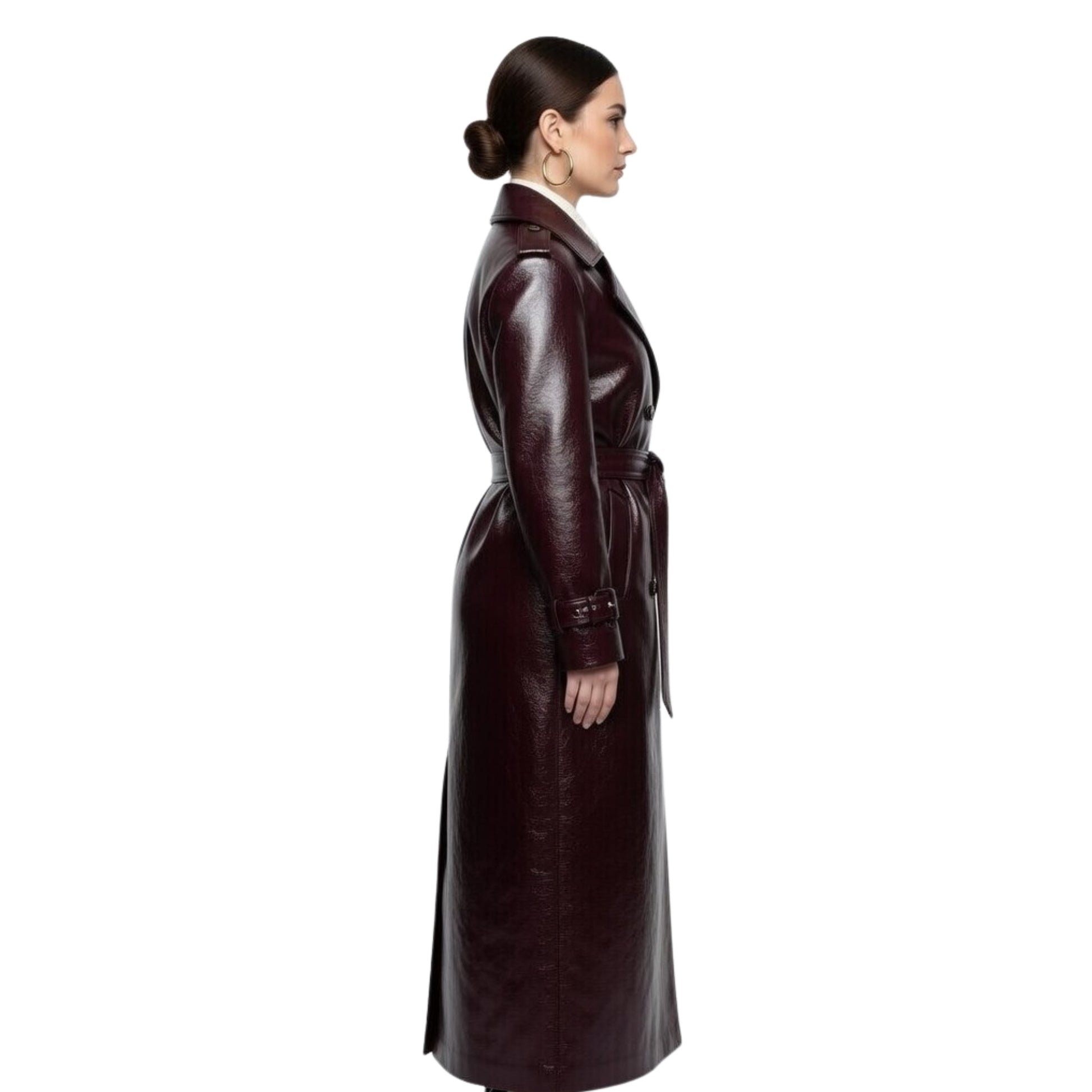 Woman wearing a long brown leather coat on a white background