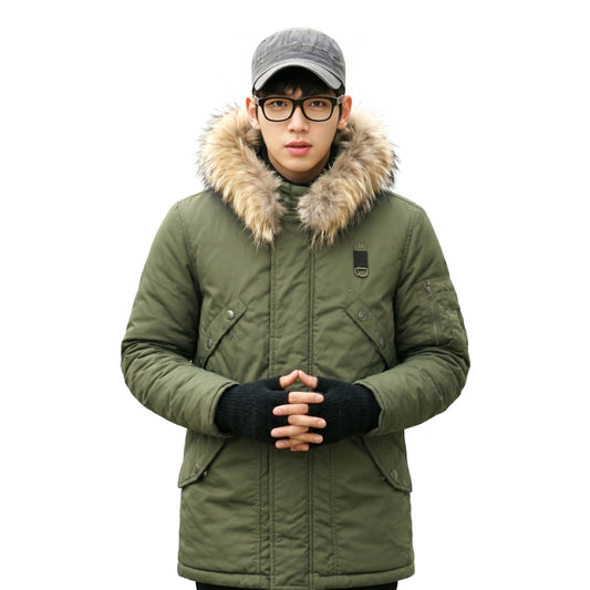 Person wearing a green winter coat with fur hood on a white background
