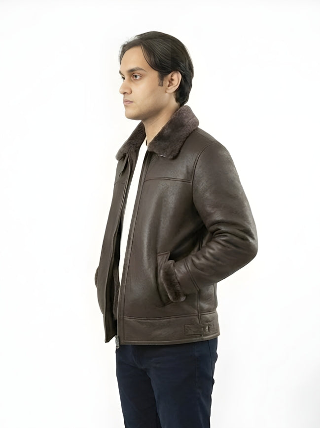 Man wearing a brown leather jacket with fur collar on a white background