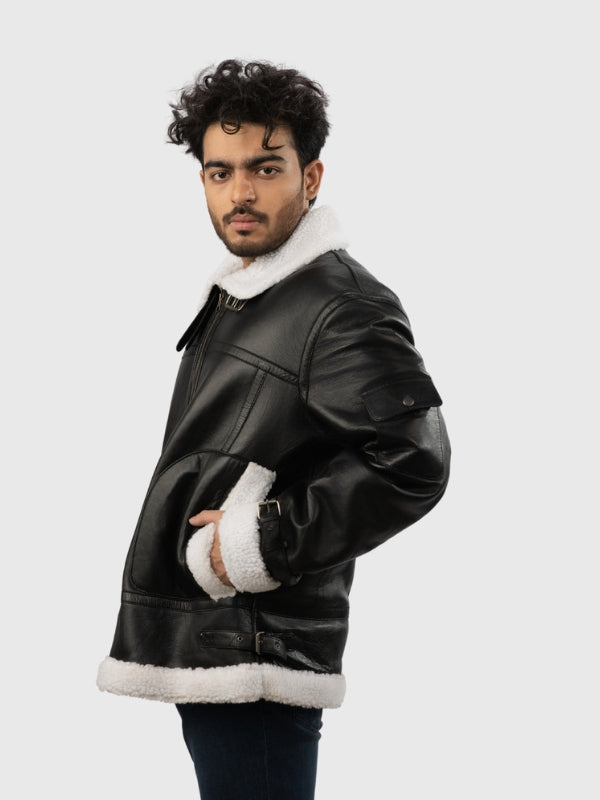 Man wearing a black leather jacket with white fur trim on a white background